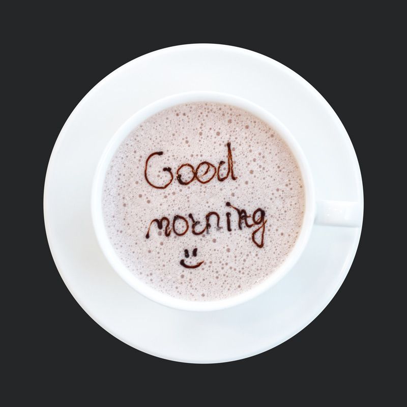 Cup of coffee with Good Morning and a smiley face written at the surface